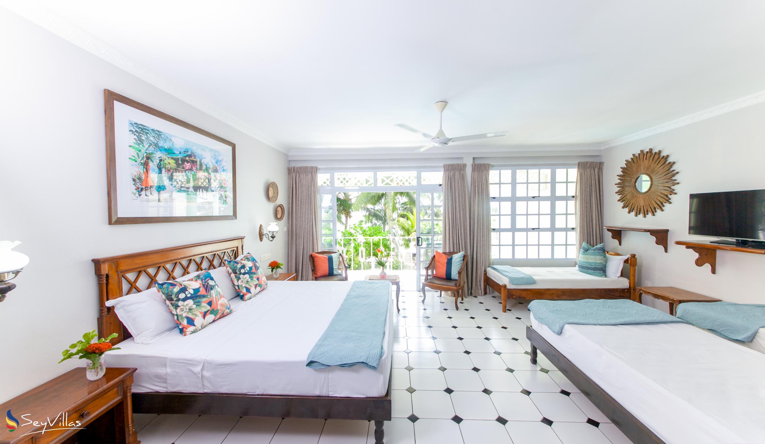 Foto 31: Palm Beach Hotel - Chambre Familiale - Praslin (Seychelles)