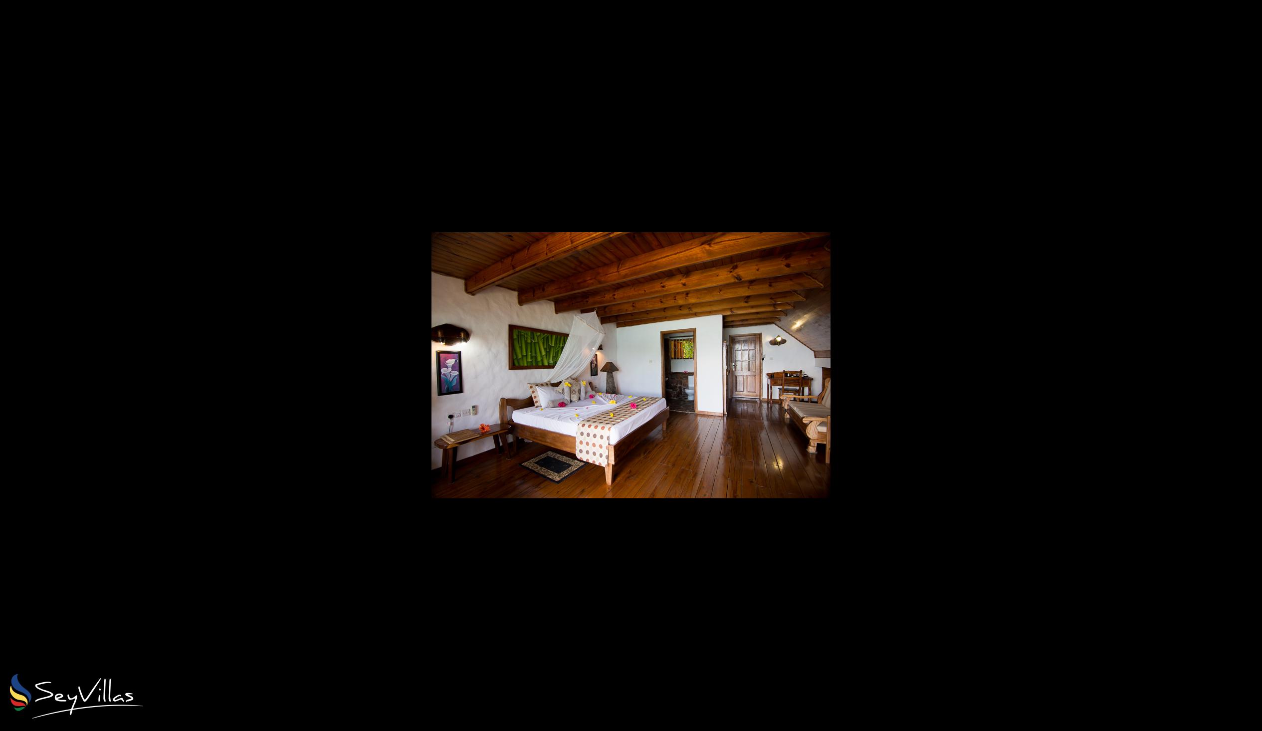 Foto 100: Colibri Guesthouse - Superior-Holzzimmer mit Meerblick - Praslin (Seychellen)