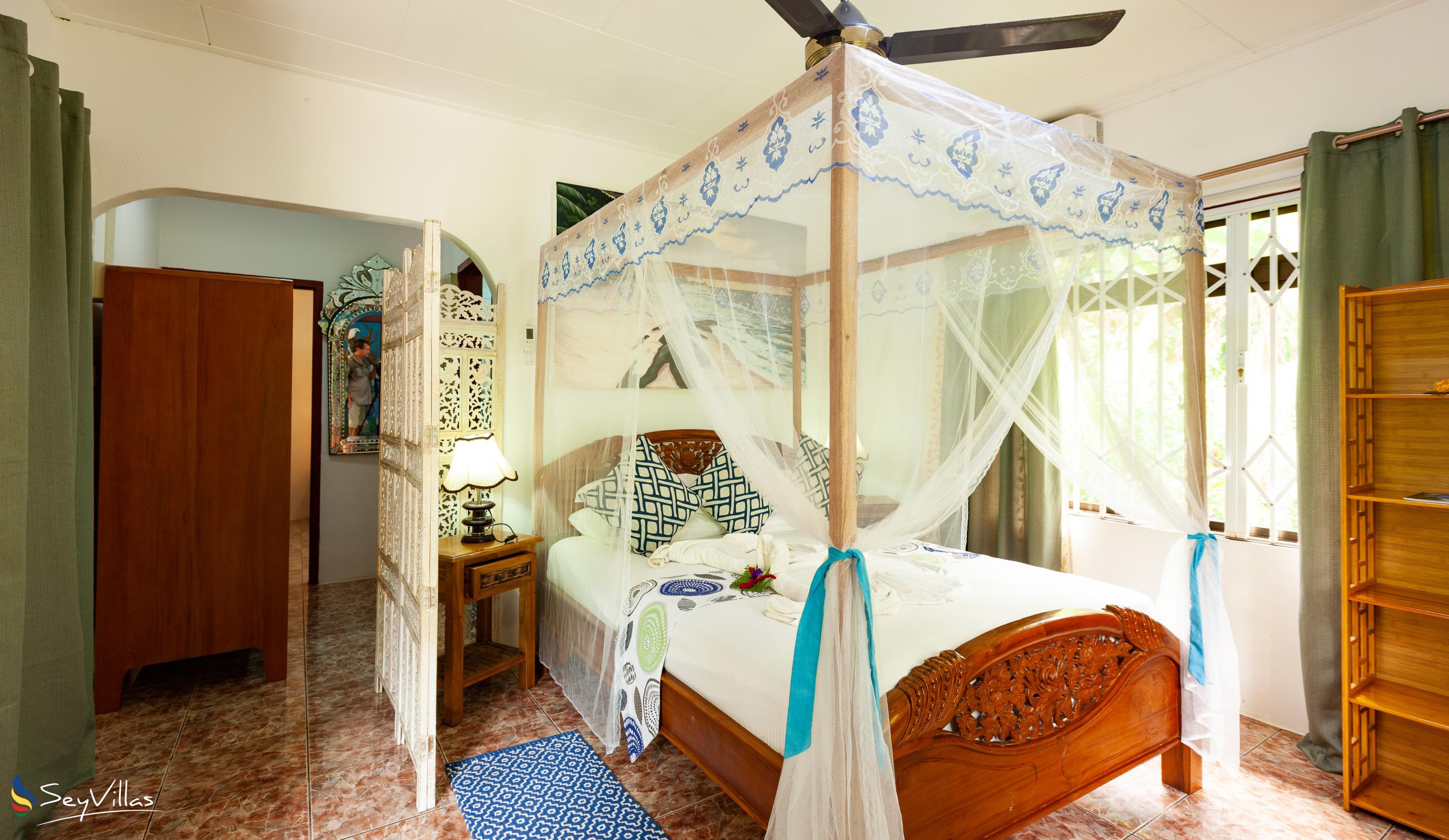 Foto 28: Buisson Guest House - Chambre Eliconia - La Digue (Seychelles)