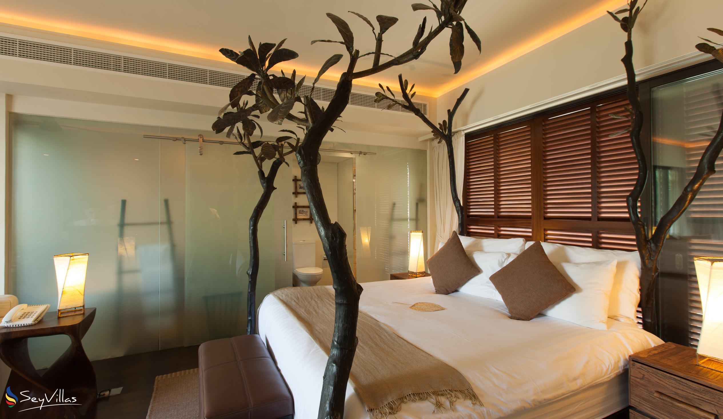 Foto 43: Dhevatara Beach Hotel - Suite vue sur la mer avec lit king-size - Praslin (Seychelles)