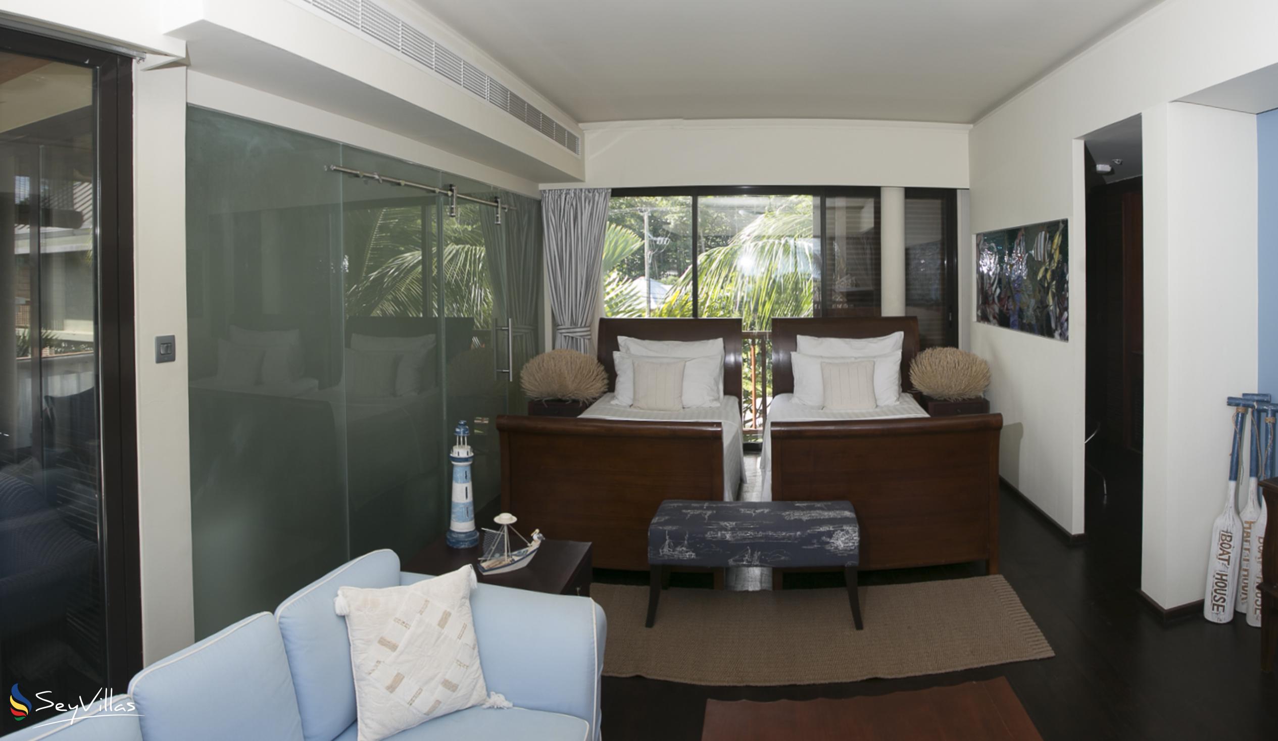 Foto 81: Dhevatara Beach Hotel - Suite vue sur la mer avec lits jumeaux - Praslin (Seychelles)